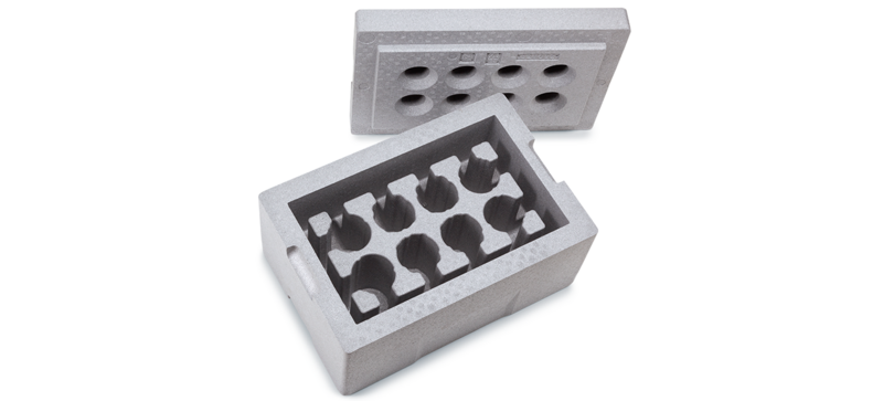 Une boîte isolante grise avec des fentes pour les flacons de laboratoire